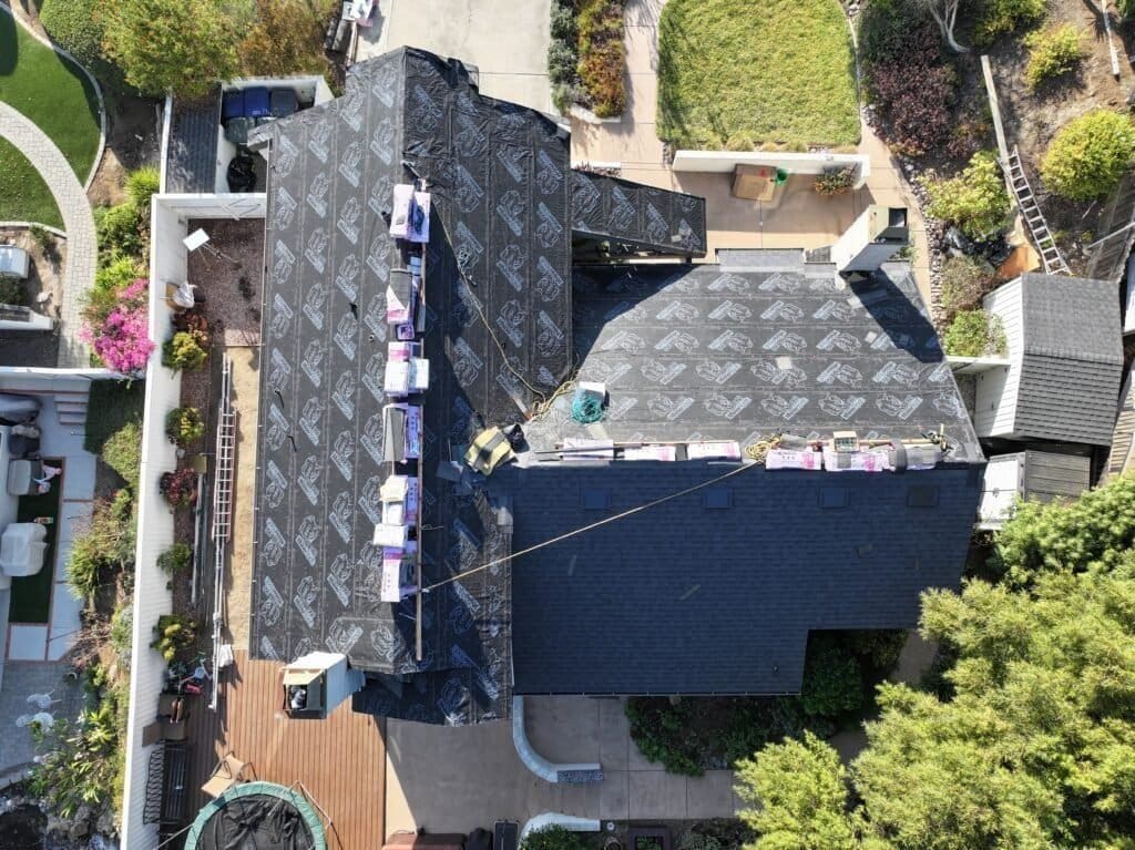 It's important to prepare a budget for your roofing project. This roof included solar panels and required a few extra steps in the planning stage.