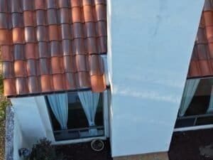 Roof Inspection: Loose tiles are about to fall off of roof.